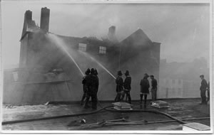 Firemen Fighting the Blaze from the Rooftops