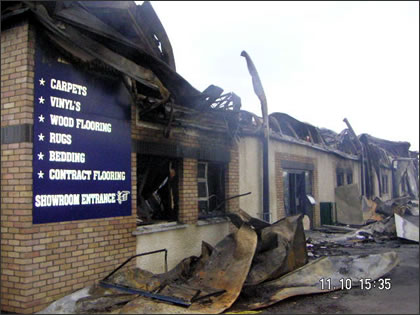 The Fire-Damaged Front of Bargain City Carpets