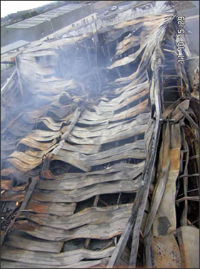 The Fire-Damaged Roof of Bargain City Carpets