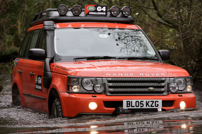 Land Rover Traversing a River 