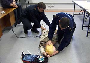 Garda Victor Isdell and Garda Tadhg Mohally putting the casualty into the recovery position