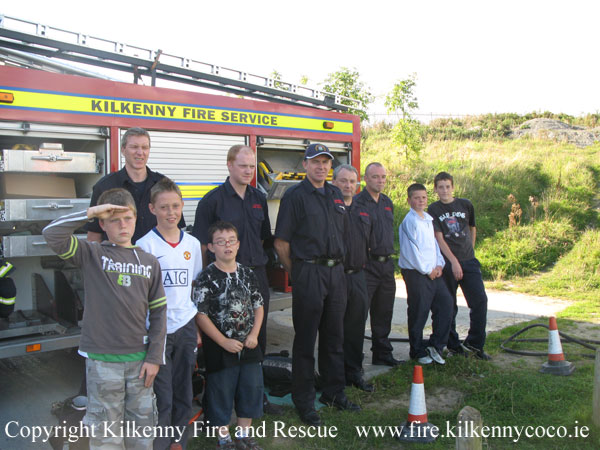 KCAN - Children pose with the fire crew