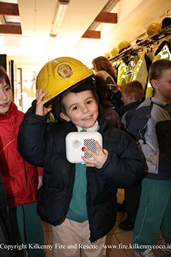 Trying on a Firemans Helmet for size
