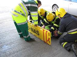 Placing the patient on a stretcher on the First Aid Training Course